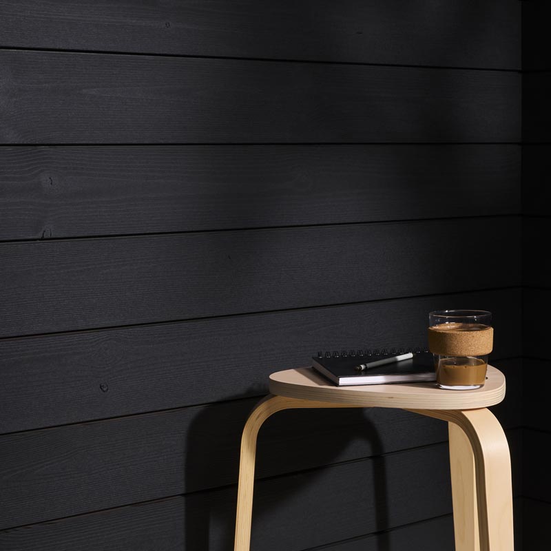 Dark cladding made of thermally modified timber